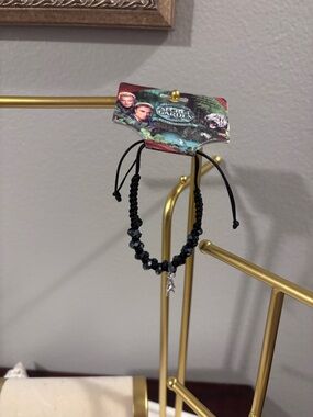 Adjustable Black/Blue Beaded Bracelet with Silver Lion Charm